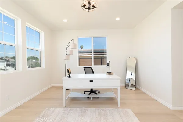 a living room with furniture and window