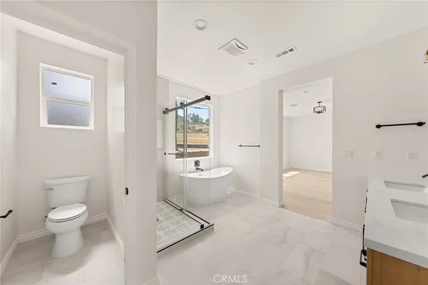 a view of an empty room and a window