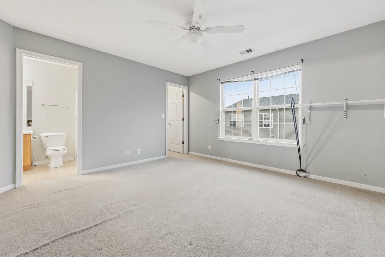 335 Holiday Lane Round Lake, IL 60073 - Photo 11 of 25 a view of an empty room with a window