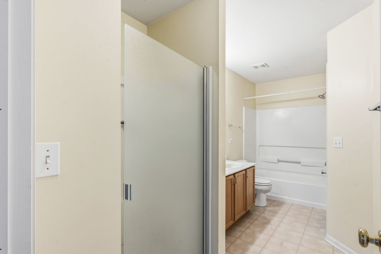 335 Holiday Lane Round Lake, IL 60073 - Photo 15 of 25 a bathroom with a shower and a sink