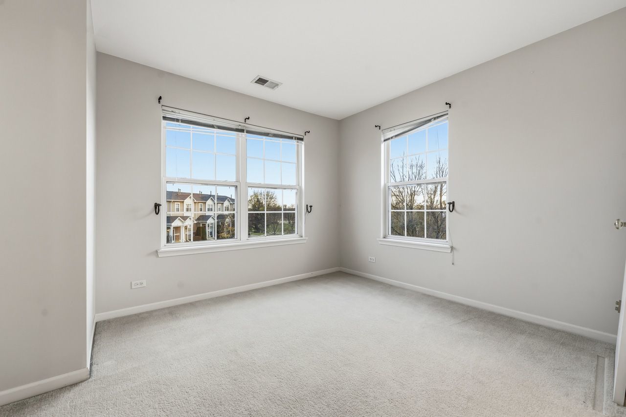 335 Holiday Lane Round Lake, IL 60073 - Photo 16 of 25 a view of an empty room with a window