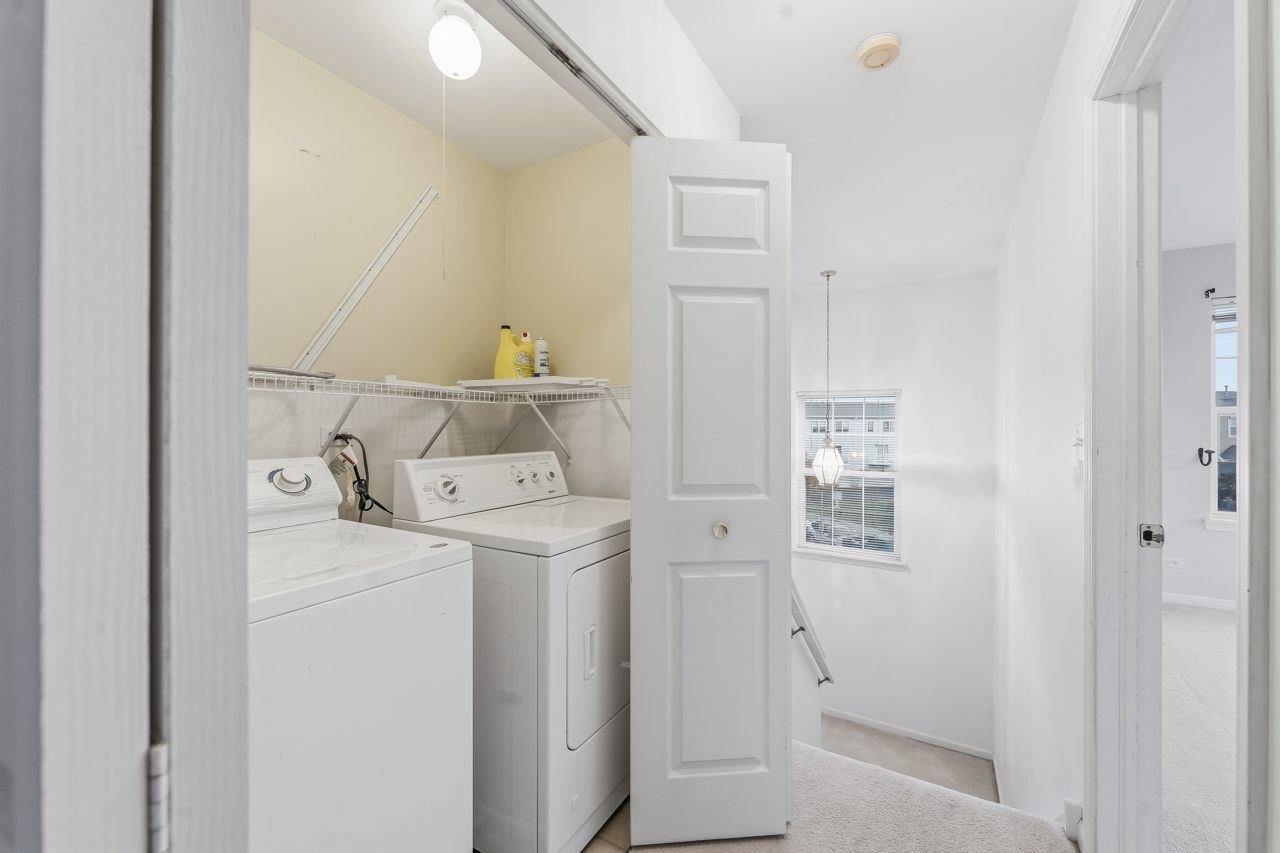 335 Holiday Lane Round Lake, IL 60073 - Photo 17 of 25 a utility room with dryer and washer