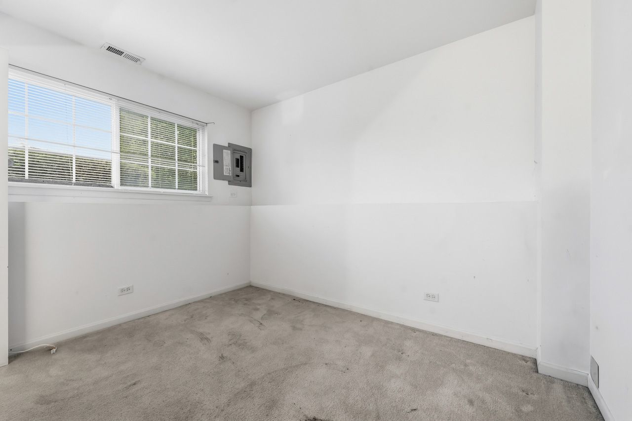 335 Holiday Lane Round Lake, IL 60073 - Photo 19 of 25 an empty room with a window