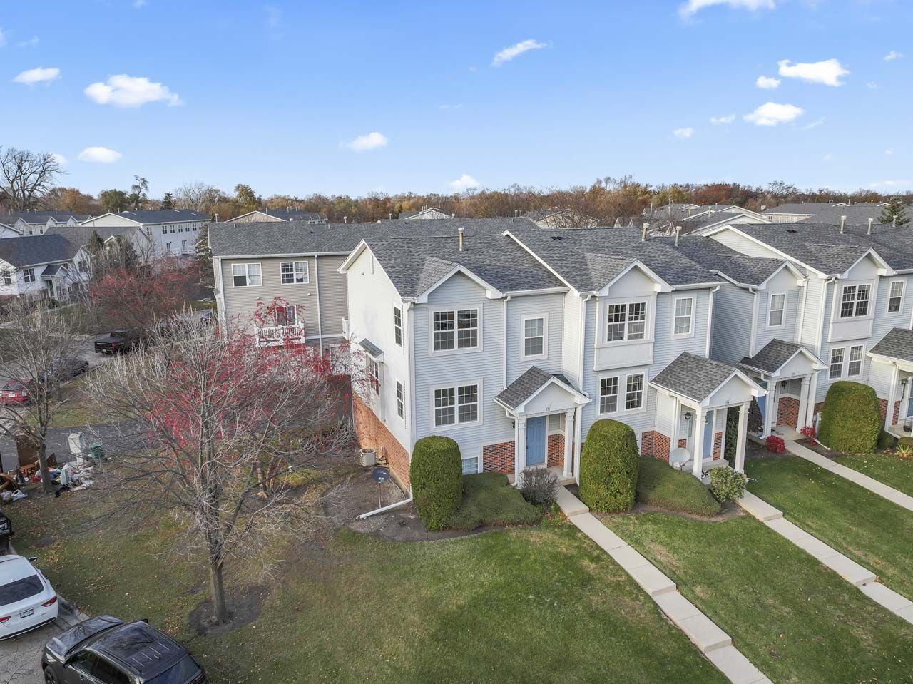 335 Holiday Lane Round Lake, IL 60073 - Photo 23 of 25 an aerial view of residential houses with yard and mountain view in back
