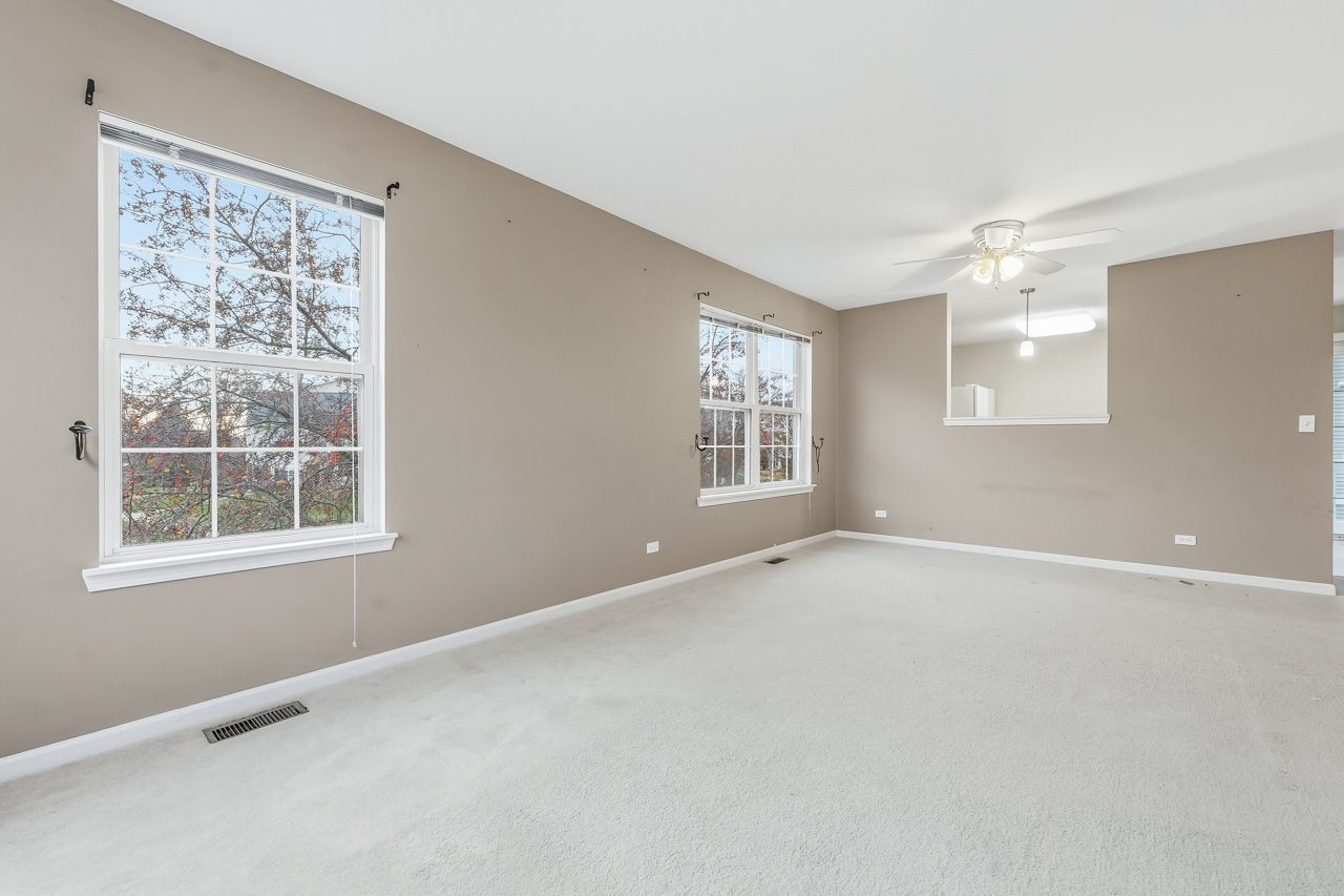 335 Holiday Lane Round Lake, IL 60073 - Photo 5 of 25 an empty room with windows and closet