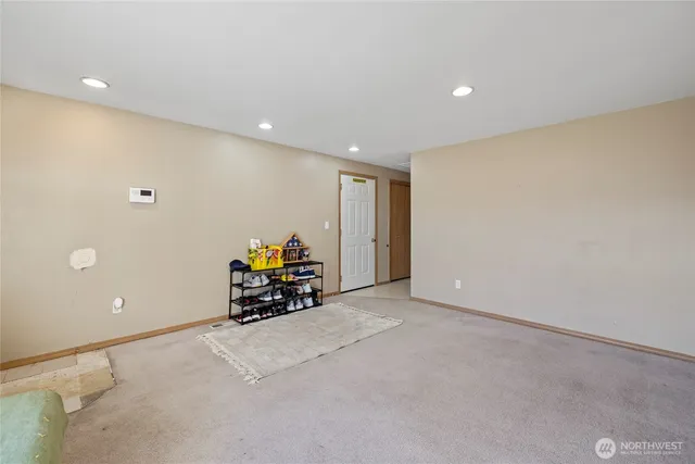 a room with furniture and a plant