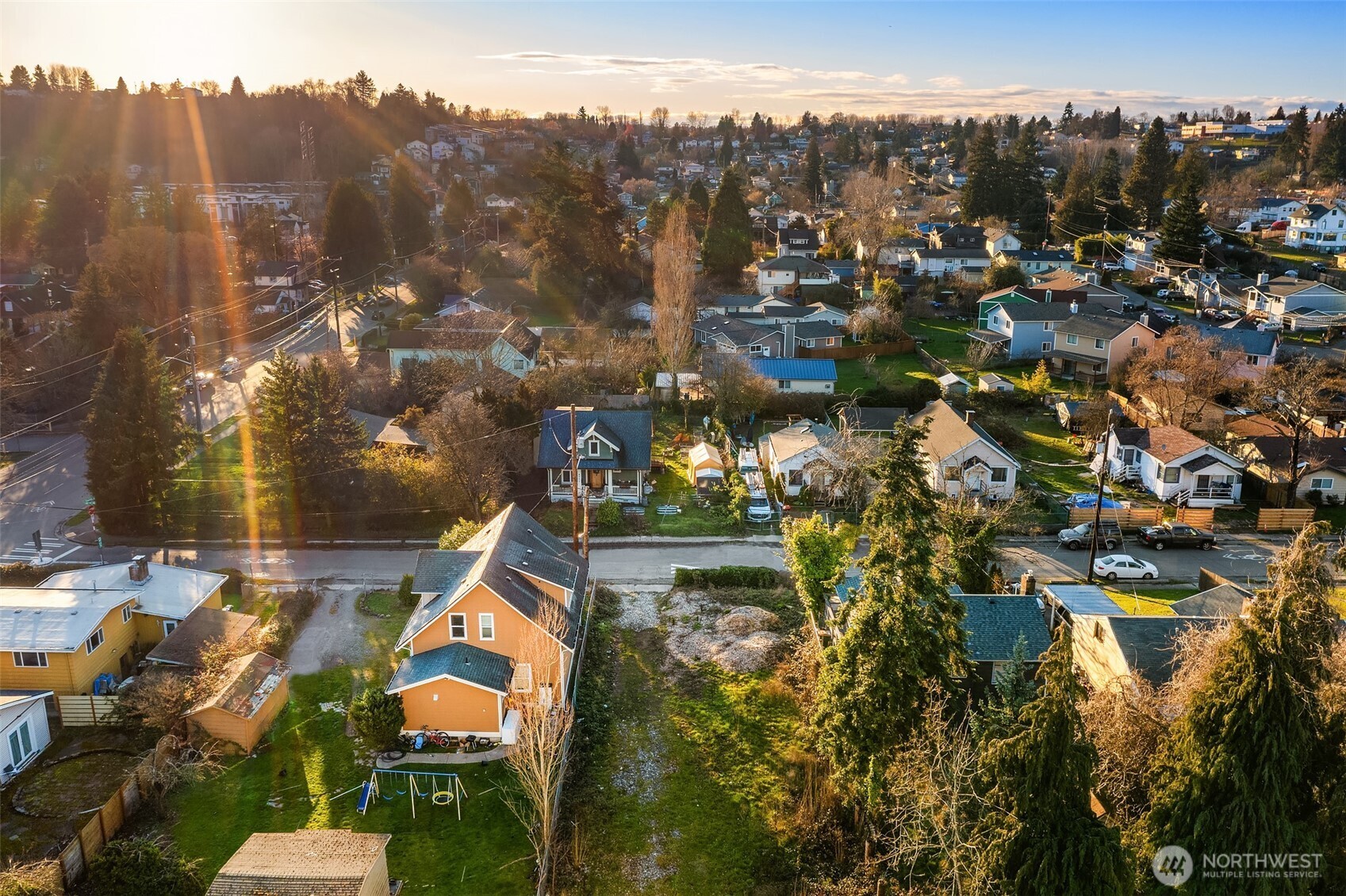 8444 46th Avenue South Seattle, WA 98118 - Photo 14 of 14 an aerial view of residential house with outdoor space and trees