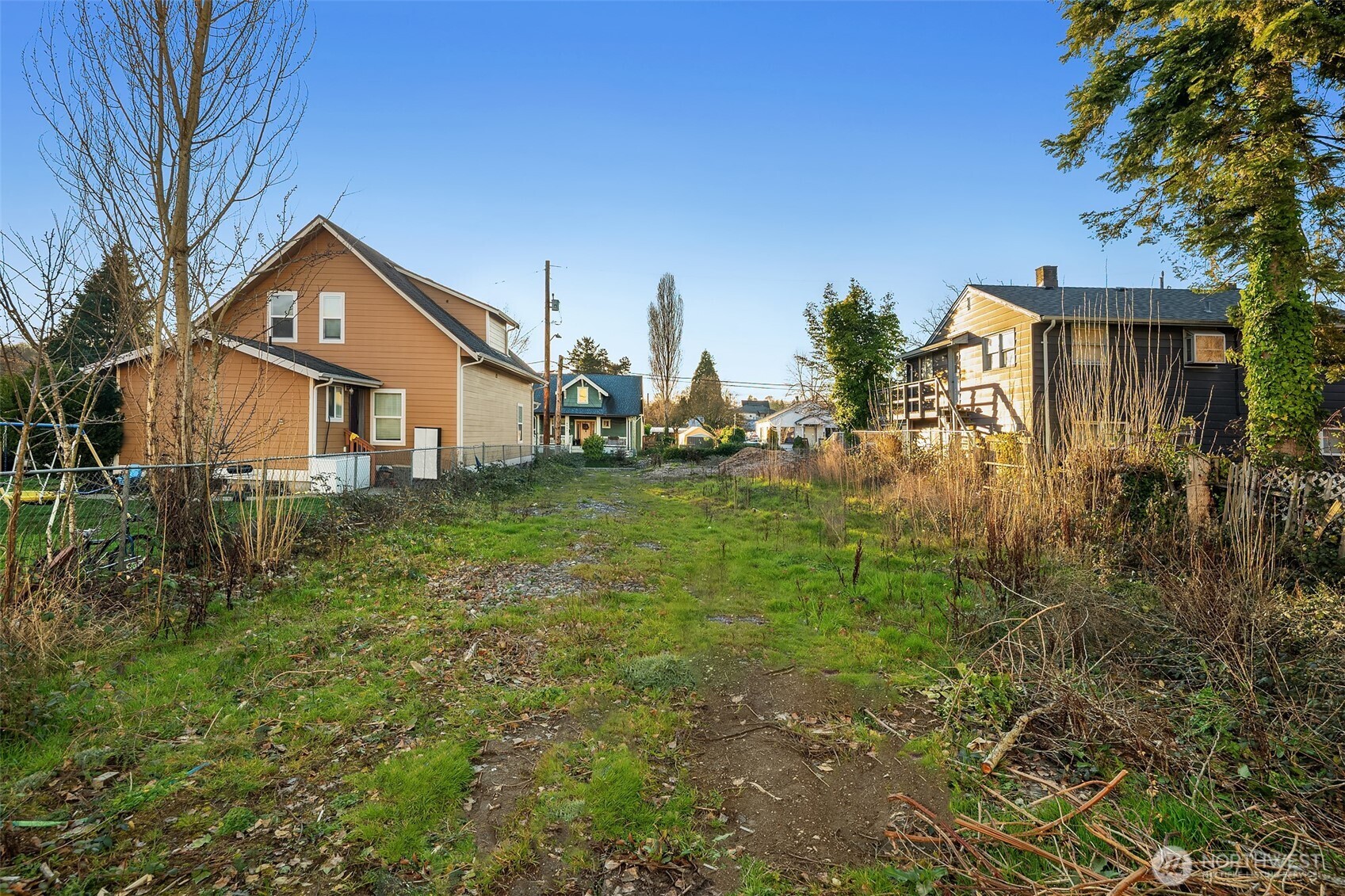 8444 46th Avenue South Seattle, WA 98118 - Photo 5 of 14 a view of a house with a yard