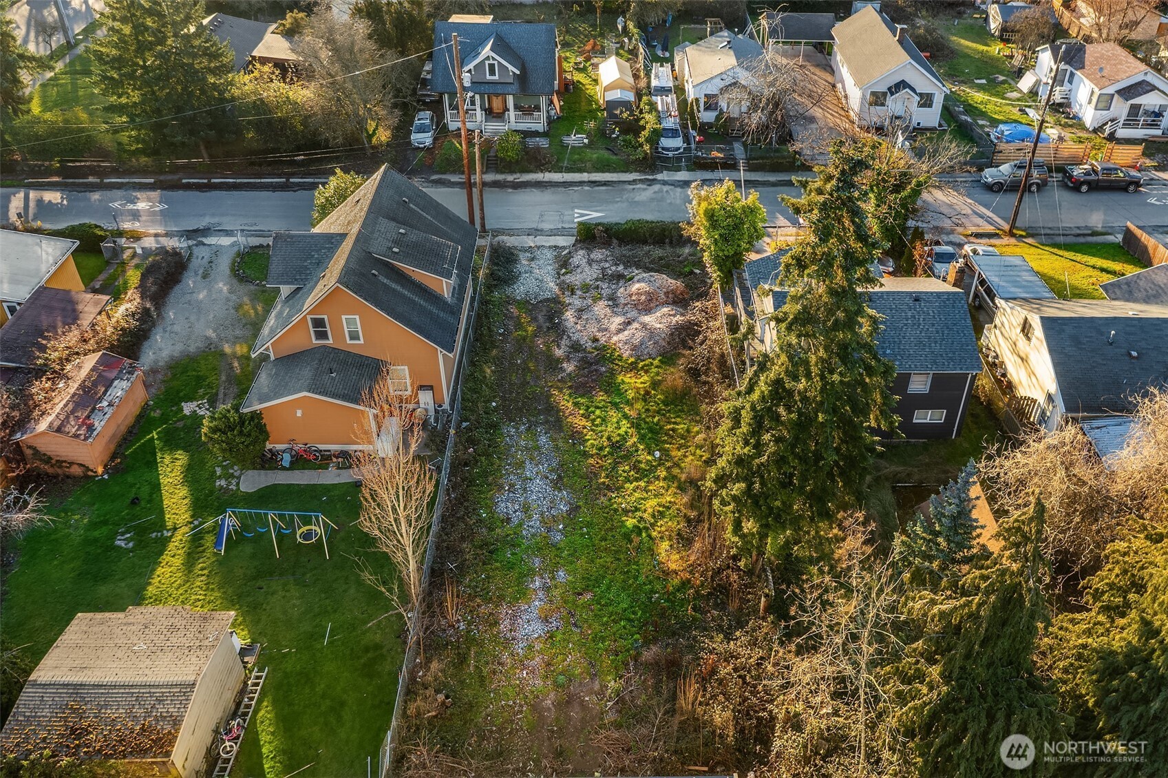 8444 46th Avenue South Seattle, WA 98118 - Photo 6 of 14 an aerial view of a house with swimming pool outdoor seating and yard