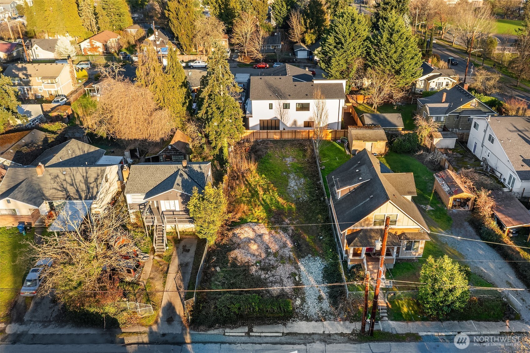 8444 46th Avenue South Seattle, WA 98118 - Photo 8 of 14 an aerial view of residential houses with outdoor space