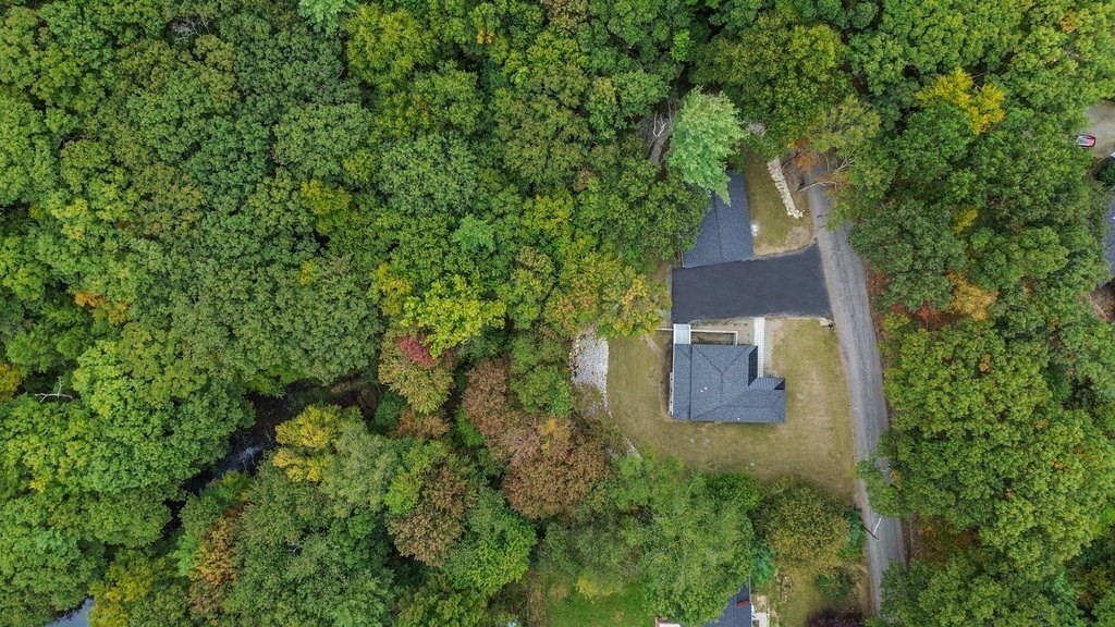 63 King Road Charlton, MA 01507 - Photo 12 of 40 an aerial view of a house with a yard and trees all around
