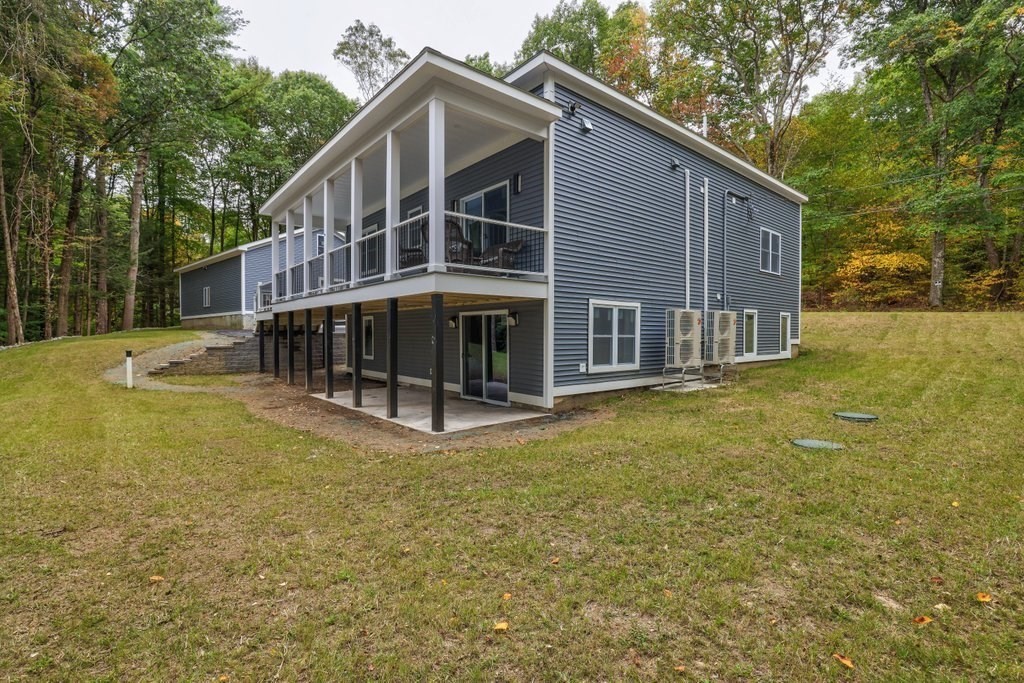 63 King Road Charlton, MA 01507 - Photo 2 of 40 a view of a house with backyard and trees