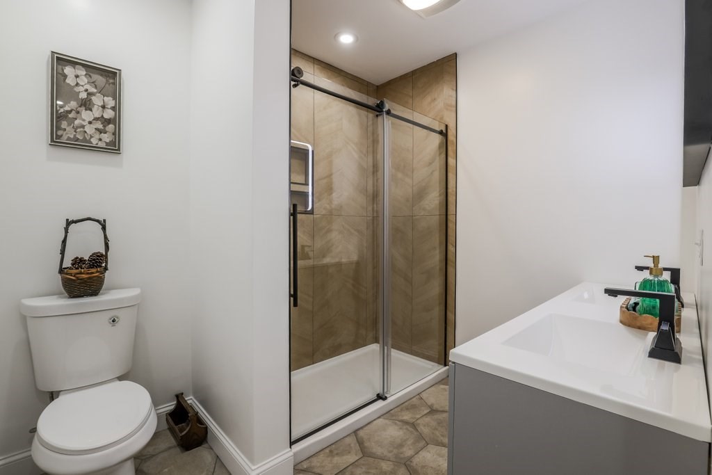 63 King Road Charlton, MA 01507 - Photo 25 of 40 a bathroom with a sink a toilet and shower