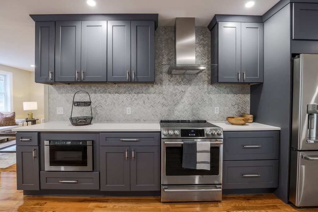 63 King Road Charlton, MA 01507 - Photo 27 of 40 a kitchen with stainless steel appliances granite countertop wooden cabinets stove and dishwasher