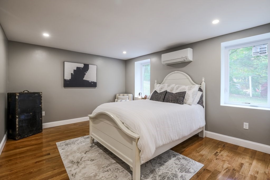 63 King Road Charlton, MA 01507 - Photo 35 of 40 a bedroom with a large bed and a window