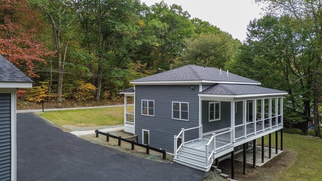 63 King Road Charlton, MA 01507 - Photo 4 of 40 a view of a house with a yard and sitting area