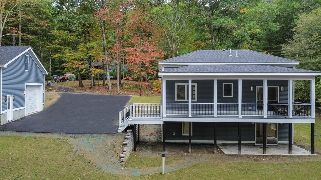 63 King Road Charlton, MA 01507 - Photo 5 of 40 a backyard of a house with table and chairs