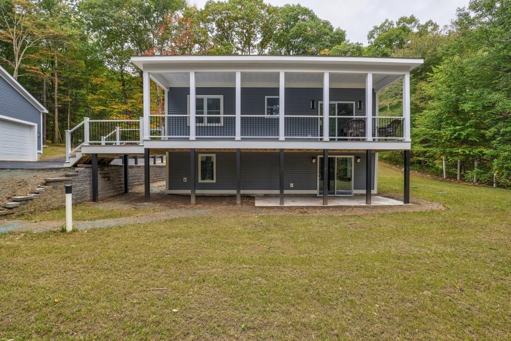 63 King Road Charlton, MA 01507 - Photo 6 of 40 a house that has a swimming pool in front of it