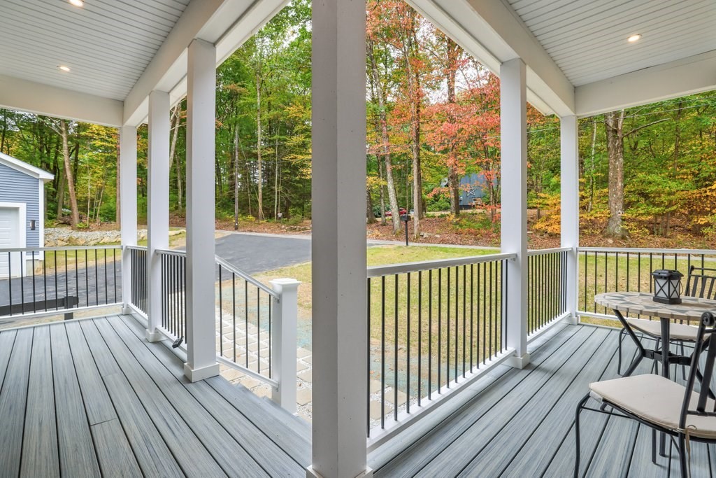 63 King Road Charlton, MA 01507 - Photo 8 of 40 a view of a balcony with wooden floor