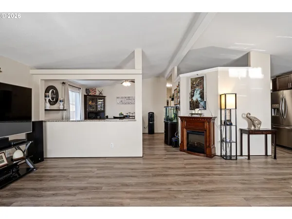 a kitchen with stainless steel appliances granite countertop a sink stove and microwave