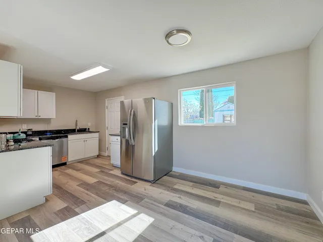 a room with wooden floor and window