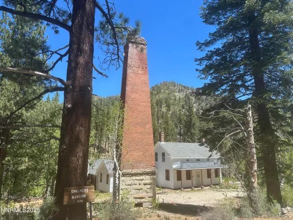 a view of a house with a tree