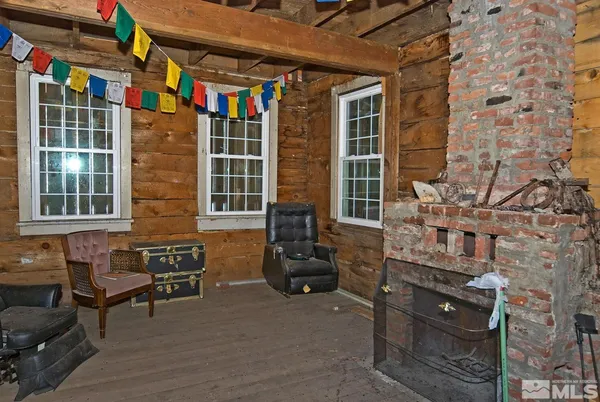 a front view of a building with outdoor seating