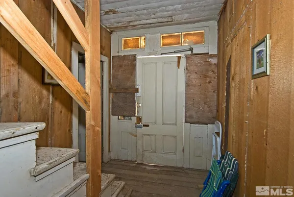 a view of a hallway with entryway door