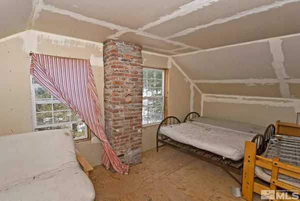 a bed room with a bed and a book shelf