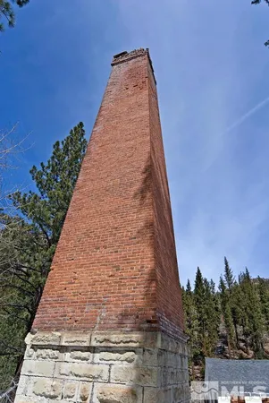 a tall building with trees in the background