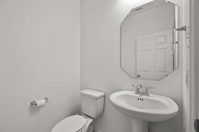 a bedroom with furniture and a large window