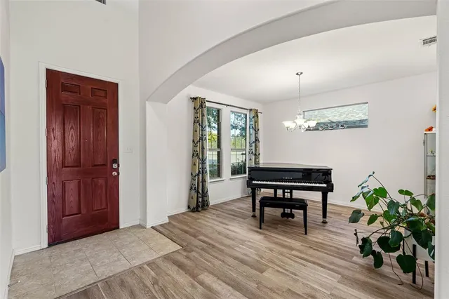 a view of a livingroom with furniture and a potted plant