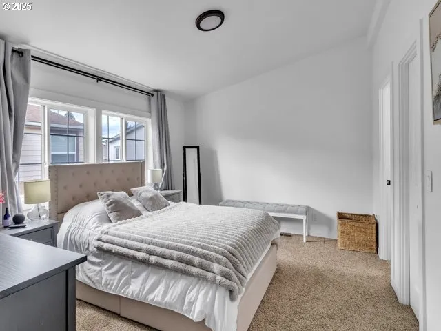 a bedroom with a bed and a couch