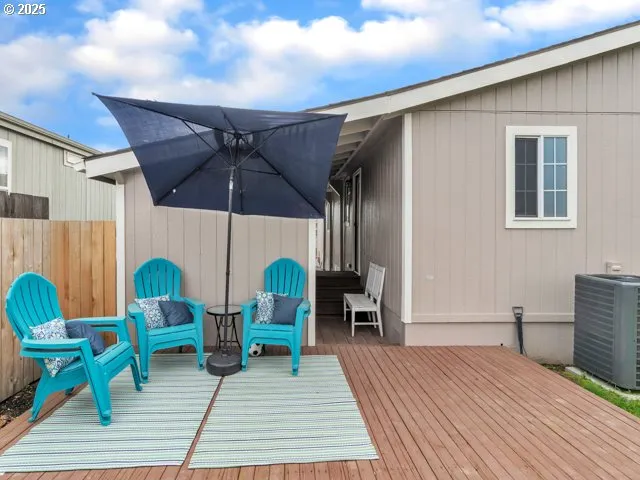 a chair and table sitting in wooden floor