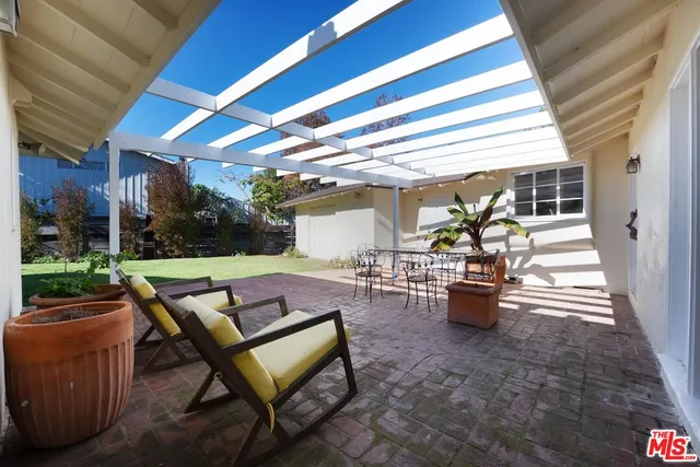 a outdoor space with patio furniture and a potted plant