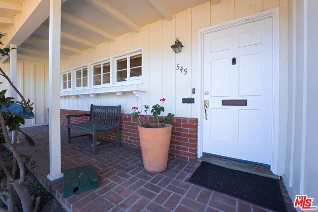a view of a living room and a potted plant