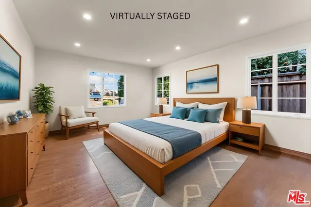 a spacious bedroom with a bed and a couch