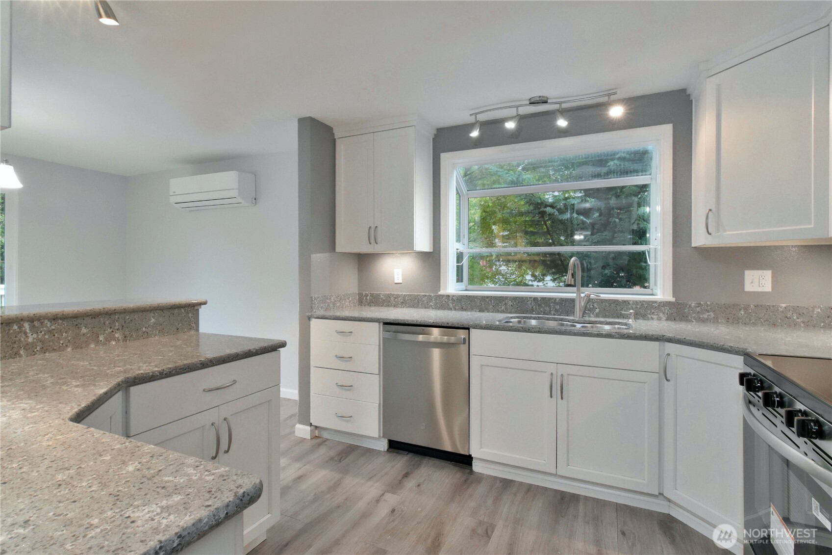 2120 178th Street Southeast Bothell, WA 98012 - Photo 13 of 38 a kitchen with granite countertop white cabinets and a window