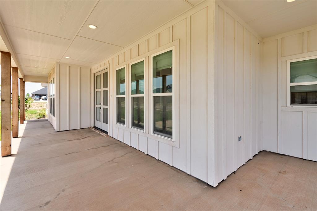 120 Long Ranger Road Abilene, TX 79602 - Photo 3 of 23 Covered concrete patio with recessed lighting and exposed wood support beams