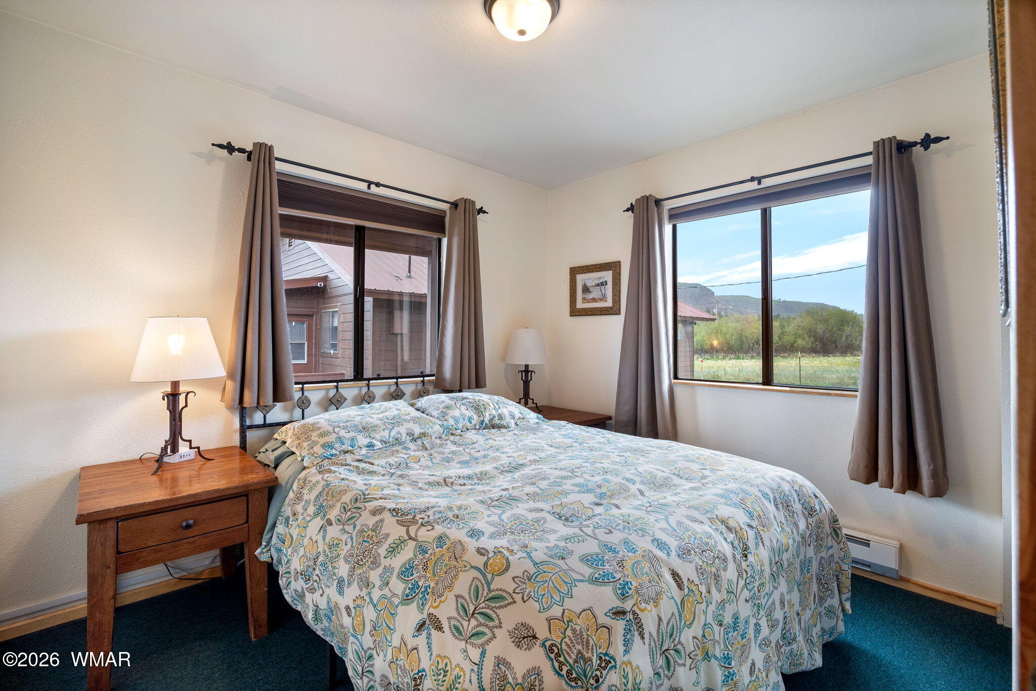 85 Main Street Greer, AZ 85927 - Photo 35 of 55 a bedroom with a bed and a window