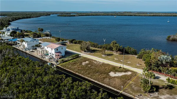 an aerial view of a house with a lake view