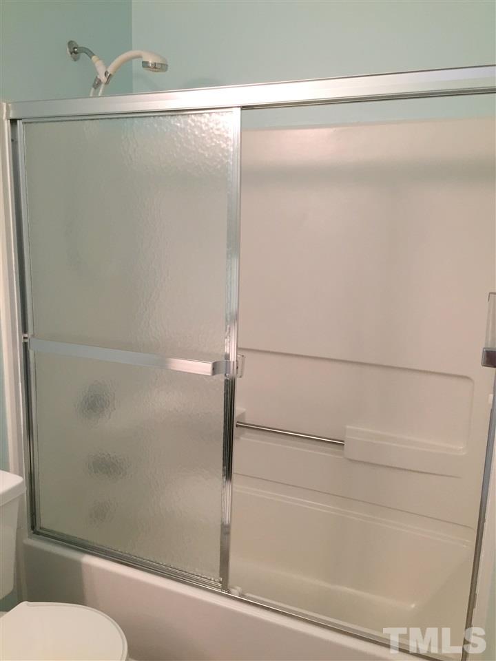 11309 North Radner Way Raleigh, NC 27613 - Photo 15 of 25 a bathroom with a shower