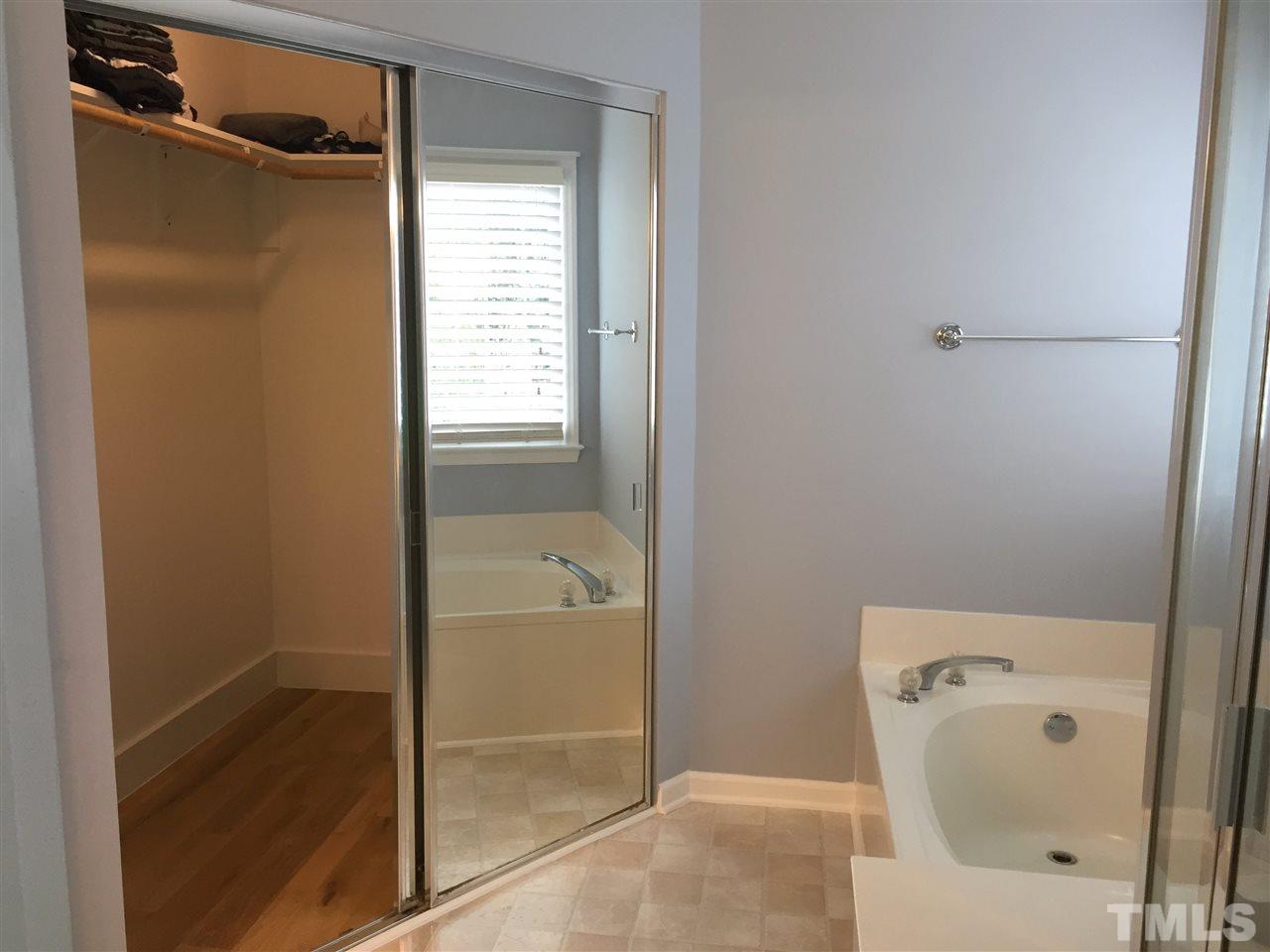11309 North Radner Way Raleigh, NC 27613 - Photo 20 of 25 a bathroom with a bathtub and shower