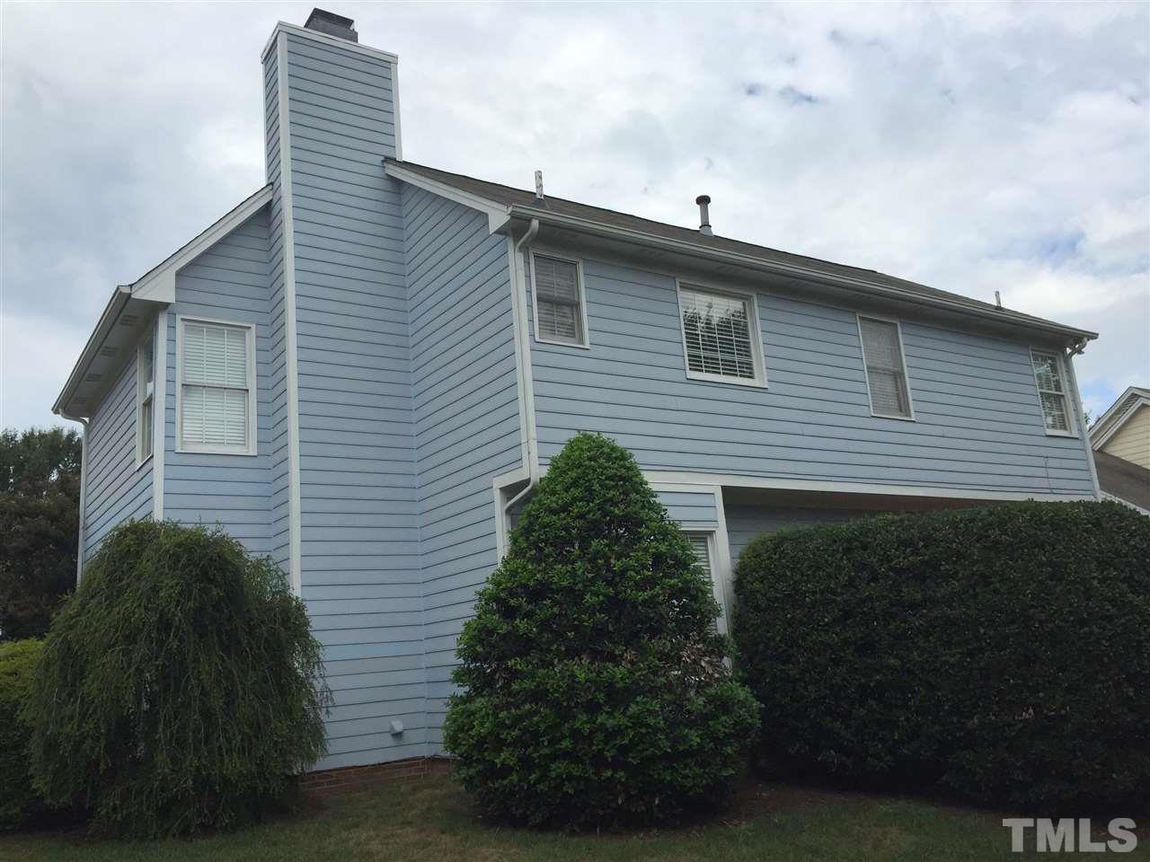 11309 North Radner Way Raleigh, NC 27613 - Photo 25 of 25 a side view of a house with a yard