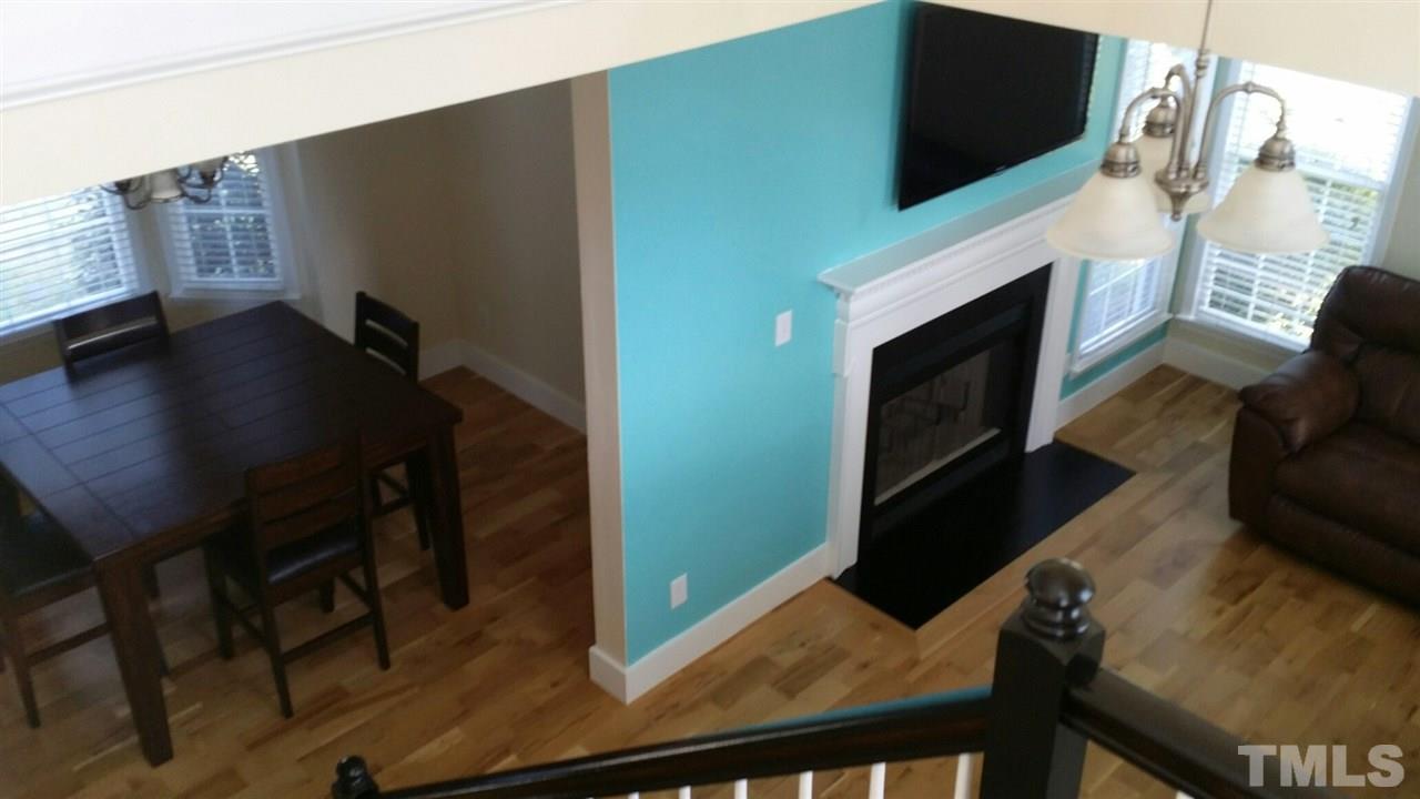 11309 North Radner Way Raleigh, NC 27613 - Photo 7 of 25 a living room with flat screen tv and a fireplace