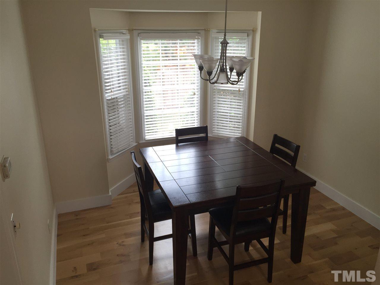 11309 North Radner Way Raleigh, NC 27613 - Photo 9 of 25 a view of a dining room with furniture and window