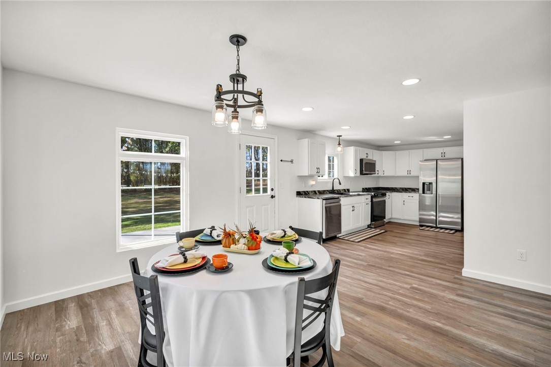 43575 Cream Ridge Road Lisbon, OH 44432 - Photo 11 of 50 Dining space with recessed lighting, light wood-type flooring, and a chandelier
