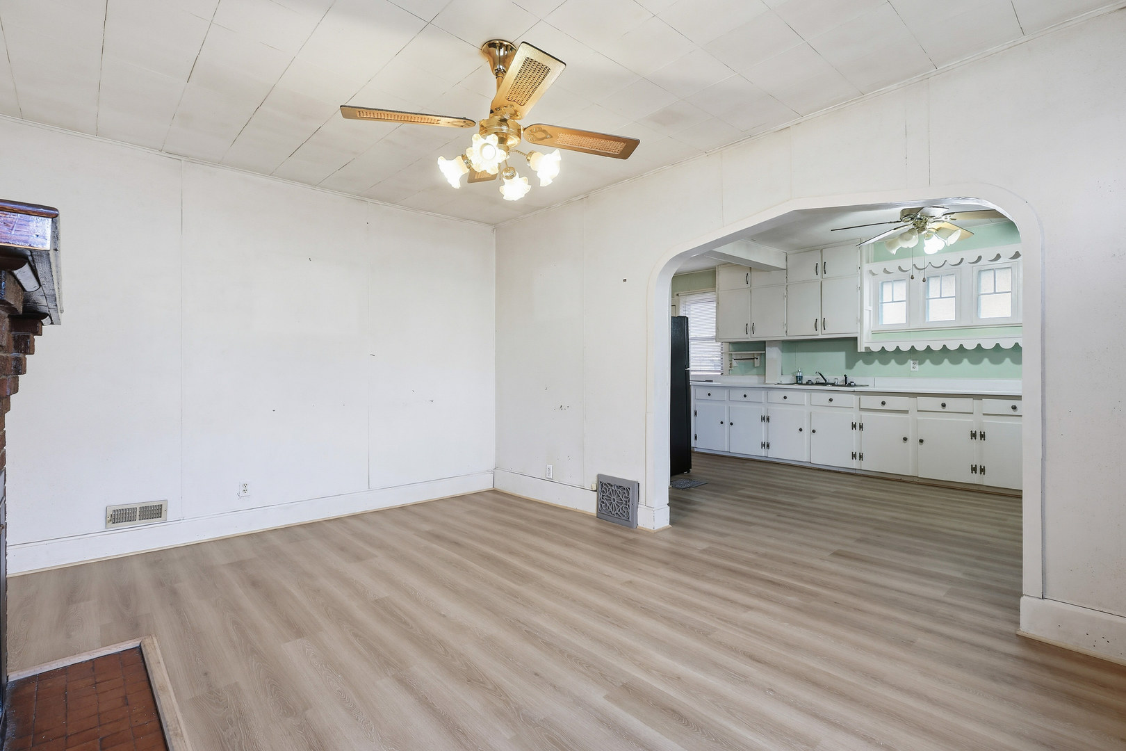 2748 12th Avenue Moline, IL 61265 - Photo 10 of 35 an empty room with wooden floor and fan