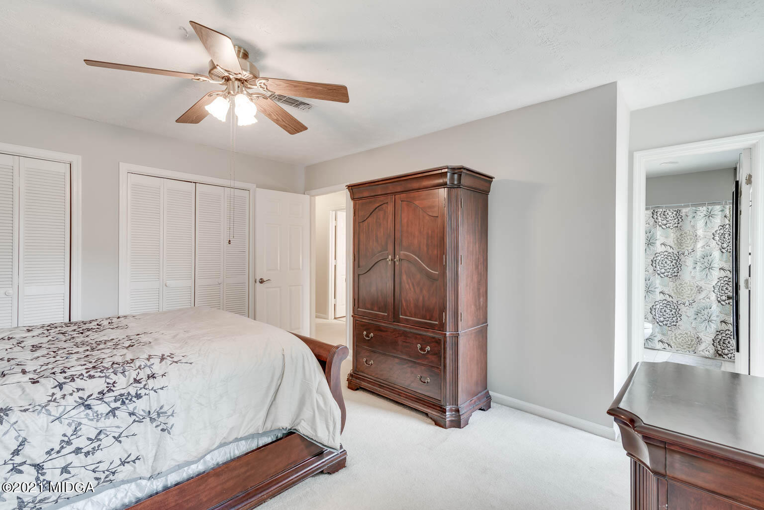 2944 Lavista Way Decatur, GA 30033 - Photo 14 of 27 a bedroom with a bed and a chandelier