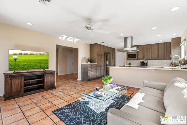 a kitchen with stainless steel appliances granite countertop a sink and a stove